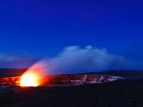 A plume of smoke rises from the volcanic activity in Kilauea crater in Volcanoes National Park in Volcano, Hawaii in this file photo from  November 27, 2012. REUTERS/Hugh Gentry/Files