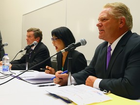 John Tory, Olivia Chow and Doug Ford during a debate at Centennial College in Toronto on Monday, October 6, 2014. (Dave Abel/Toronto Sun)