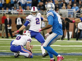 Buffalo Bills kicker Dan Carpenter (2) makes a game-winning field goal during the fourth quarter as punter Colton Schmidt (6) holds the ball against the Detroit Lions at Ford Field. (Raj Mehta-USA TODAY Sports)