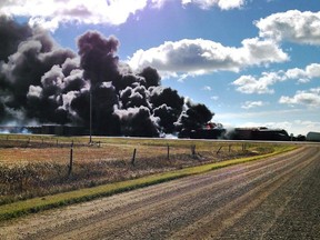 Smoke is seen from a train derailment on a CN rail line between Canora and Biggar Saskatchewan on Tuesday Oct. 7, 2014. Wadena News/QMI Agency