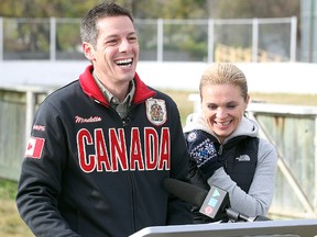 Mayor-Elect Brian Bowman (left) and his wife Tracy share a laugh, possibly over the story of that time with the bison smokies.