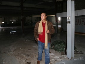 Salvatore Colacitti walks through his Station Street building, formerly Trudeau Motors, that was recommended to council as the preferred site to house the city's new police station. - Jason Miller/ The Intelligencer/QMi Agency
