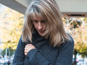 Sir Robert Borden High School teaching assistant Kathy Kitts leaves the Elgin Street courthouse on Tuesday October 7, 2014. 
Errol McGihon/Ottawa Sun/QMI Agency