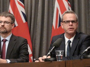 Provincial education minister James Allum, right, and Manitoba Teachers Society president Paul Olson speak at a press conference Tuesday, Oct. 6, 2014 after a report released indicated Manitoba education is dead last in Canada in reading, science and math. (Tom Brodbeck/Winnipeg Sun/QMI Agency)