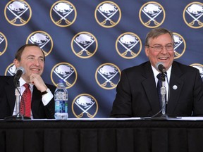 NHL Commissioner Gary Bettman laughs with Buffalo Sabres owner Terry Pegula during a news conference announcing new ownership on February 22, 2011. (REUTERS/Gary Wiepert)