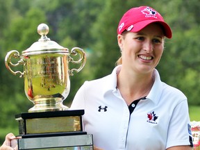 Augusta James of Bath holds the Duchess of Connaught Trophy after winning the Canadian Women's Amateur Championship in Woodstock, Ont., on July 25. (GREG COLGAN/QMI Agency)