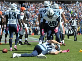 Browns’ Christian Kirksey drilled Titans’ Jake Locker (on ground) in the head during their game on Sunday. (USA TODAY SPORTS)