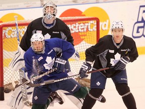 Defenceman Stephane Robidas (right) keeps an eye on David Clarkson at Maple Leafs practice on Tuesday. (Stan Behal/Toronto Sun)