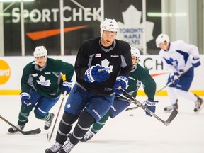 Maple Leafs defenceman Cody Franson (centre) takes part in the team’s workout yesterday for the first time since he suffered a knee injury during a pre-season game on Sept. 26. (ERNEST DOROSZUK/Toronto Sun)