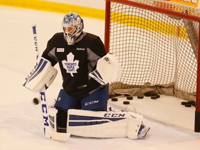 Goaltender Jonathan Bernier makes a save at Maple Leafs practice Tuesday. Bernier should get the start when Toronto opens its season at home Wednesday night against the Montreal Canadiens. (Stan Behal/Toronto Sun)