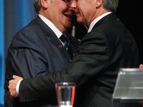 Former Premier Dave Hancock welcomes the new boss, Jim Pentice, in this file photo after the later became Alberta Tory leader.