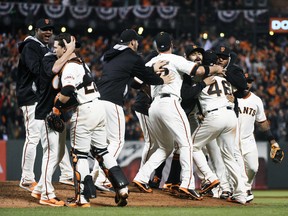 San Francisco Giants players celebrate on the field after defeating the Washington Nationals in Game 4 of the National League Division Series at AT&T Park in San Francisco, Oct. 7, 2014. (KYLE TERADA/USA Today)