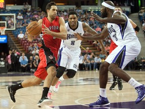Raptors guard Landry Fields drives to the basket against Sacramento Kings forward — and former Raptor — Reggie Evans during the first quarter on Oct. 7 at Sleep Train Arena. (USA Today)