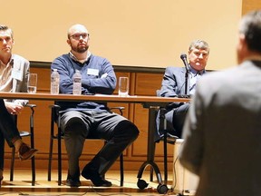 Gino Donato/The Sudbury Star     
Guest panel members, from left, Kirk Petroski, Don Duval, Brian Jones and Greg Baiden, listen as an audience member asks a question during the Vita Signs, mining innovation edition discussion, on Tuesday.