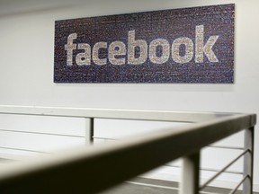 The Facebook logo is pictured in the Facebook headquarters in Menlo Park, California Jan. 29, 2013.  REUTERS/Robert Galbraith
