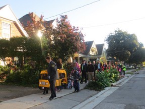Students, parents and volunteers from Lorne Ave. public school take part in International Walk to School Day, the last time students from the Old East Village school will do so. About two dozen kids took part in the Walking School Bus, part of Walking Wednesday. (KATE DUBINSKI, The London Free Press)