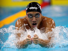 Naoya Tomita of Japan swims during the men's 200m breaststroke heat at the 10th FINA World Swimming Championship (25m) in Dubai December 17, 2010. (REUTERS/Rabih El Moghrabi)
