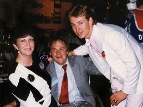 Edmonton Oilers Wayne Gretzky gets his picture taken with Cam Tait and Alice Gagnon during the civic championship reception at Edmonton Convention Centre on May 22, 1984. (Edmonton Sun/Qmi Agency file photo)