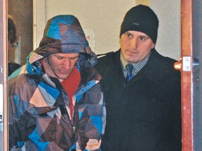 Timmy Engel, who is facing a first degree murder charge in the killing of Vulcan-area resident Otto “Bunty” Loose, is escorted Jan. 17, 2012, from the High River RCMP detachment to Lethbridge remand. QMI Agency