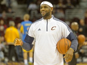 LeBron James of the Cleveland Cavaliers warms up prior to the game against Maccabi Tel Aviv at Quicken Loans Arena on October 5, 2014. (Jason Miller/Getty Images/AFP)