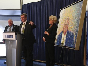 Mayor Rob Ford, joined by his mom Diane Ford, and Councillor Gary Crawford (Ward 36) unveils Crawford's painting of the mayor commissioned by Diane. (Stan Behal/Toronto Sun)