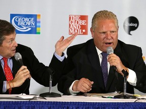 John Tory and Doug Ford in heated debate at George Brown College in Toronto during the mayoral race on October 8, 2014. (Craig Robertson/Toronto Sun)