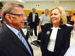 Conservative MP Guy Lauzon chats with Whitby-Oshawa MPP Christine Elliott on Wednesday Oct. 8, 2014 in Morrisburg, Ont. (DAVID AKIN/QMI Agency)