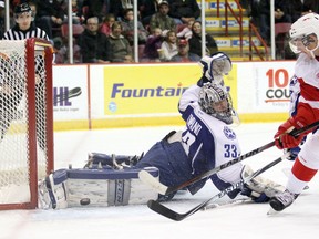 Sudbury Wolves goaltender Troy Timpano makes a save against Soo Greyhounds right winger Zachary Senyshyn during first-period play Wednesday, Oct. 8, 2014 at Essar Centre in Sault Ste. Marie, Ont.
