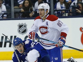 Maple Leafs winger James van Riemsdyk (left) is taken down by the Canadiens’ Max Pacioretty last night at the ACC. (Craig Robertson/Toronto Sun)