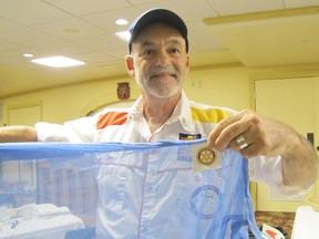 Mosquitero Project coordinator Steve Baker poses with a Rotary-sponsored net.