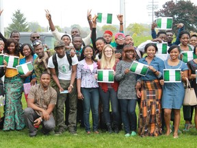 A group of enthusiastic, patriotic Lambton College students celebrate Nigerian Independence Day on October 1, 2014. Nigeria gained its independence in 1960.  CARL HNATYSHYN/SARNIA THIS WEEK/QMI AGENCY.