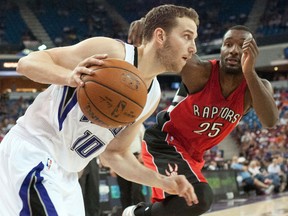 Sacramento Kings guard Nik Stauskas (10) drives to the basket against Toronto Raptors forward Jordan Hamilton (25) during the third quarter at Sleep Train Arena.The Sacramento Kings defeated the Toronto Raptors 113-106. (Ed Szczepanski-USA TODAY Sports)