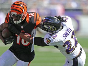 Cincinnati Bengals wide receiver A.J. Green (18) is tackled after a catch by Baltimore Ravens cornerback Jimmy Smith (22) at M&T Bank Stadium. (Mitch Stringer-USA TODAY Sports)