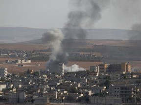 Smoke rises in the Syrian town of Kobani. (REUTERS/Umit Bektas)