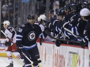 Winnipeg Jets forward Eric O'Dell celebrated his first NHL goal Jan. 11, 2014. Now he's headed back to the AHL.