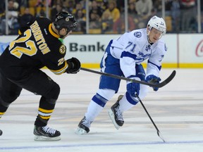 Boston Bruins right wing Shawn Thornton (22) and Tampa Bay Lightning right wing Richard Panik (71) battle for a loose puck during the second period at TD Banknorth Garden Nov 11, 2013. (Bob DeChiara-USA TODAY Sports)