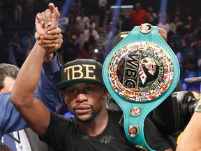 WBC/WBA welterweight champion Floyd Mayweather, Jr. celebrates his victory over Marcos Maidana in Las Vegas on Sept. 13, 2014. (Steve Marcus/Reuters)