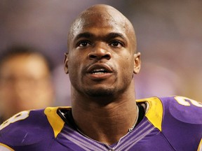 This December 30, 2013 file photo shows Adrian Peterson of the Minnesota Vikings looking on during a game against the Green Bay Packers at Mall of America Field at the Hubert H. Humphrey Metrodome in Minneapolis, Minnesota. (Files/Andy Clayton King/Getty Images/AFP)