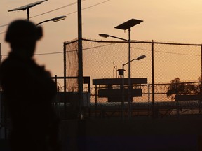 A federal police officer stands guard outside the Altiplano prison in Almoloya de Juarez.

REUTERS/Henry Romero