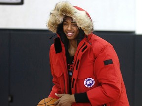 Raptors rookie Bruno Caboclo tries out a Canada Goose winter jacket during Thursday’s practice at the Air Canada Centre as the Brazilian braces for Toronto’s cold winter weather. (CRAIG ROBERTSON/TORONTO SUN)