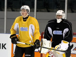 Kingston Frontenacs goalie Jeremy Helvig watches the action as teammate Lawson Crouse stands in front of him during a recent practice at the Rogers K-Rock Centre. (Ian MacAlpine/The Whig-Standard)