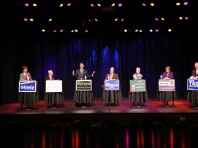 Belleville's mayoral candidates, from left, Bill Glisky, Kenzo Dozono, Richard Courneyea, Lonnie Herrington, Pat Culhane, Jill Raycroft and Taso Christopher are back in the political ring for a second Belleville and District Chamber of Commerce debate this week, but this time at The Empire Theatre in downtown Belleville, Ont. Thursday evening, Oct. 9, 2014.  - JEROME LESSARD/THE INTELLIGENCER/QMI AGENCY