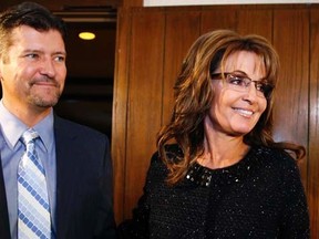 Former Republican governor of Alaska Sarah Palin and her husband Todd in Asheville, North Carolina November 7, 2013. REUTERS/Chris Keane
