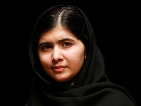 File photo of Pakistani activist Malala Yousafzai posing during an event at the Southbank Centre in central London on October 20, 2013. (REUTERS/Olivia Harris/Files)