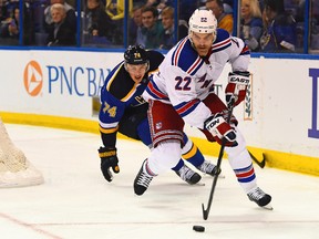 Blues right wing T.J. Oshie (left) chases Rangers defenceman Dan Boyle (right) during second period NHL action in St. Louis on Thursday. Boyle suffered a hand injury in the Rangers win and is out four-to-six weeks. (Jasen Vinlove/USA TODAY Sports)