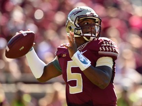 Florida State Seminoles quarterback Jameis Winston (5) drops back to pass against the Wake Forest Demon Deacons during the first quarter at Doak Campbell Stadium on Oct 4, 2014 in Tallahassee, FL, USA. (John David Mercer/USA TODAY Sports)