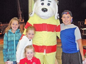 Some of those attending the West Perth fire department's open house Oct. 7, and meeting Sparky, were, from left, back Cleo Wight and her two sisters, Harmony; centre, and Trinity, front; and Landon Vandervelde (right). KRISTINE JEAN/MITCHELL ADVOCATE