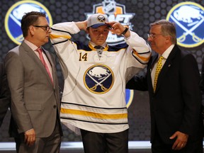 Sam Reinhart puts on a team cap after being selected as the second overall pick by the Buffalo Sabres during the 2014 NHL Draft in Philadelphia in June. Buffalo is reportedly set to host the 2016 draft. (Bill Streicher/USA TODAY Sports/Files)