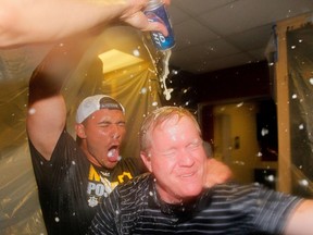Colman Byfield says a beer league without beer is no league at all. The guys in this picture aren't in a beer league, but they apparently like beer. Pictured: Pittsburgh Pirates GM Neal Huntington is doused with beer by Tony Sanchez #26 as they celebrate clinching a National League playoff spot after their 3-2 win over the Atlanta Braves at Turner Field on September 23, 2014 in Atlanta, Georgia.   Kevin C. Cox/Getty Images/AFP