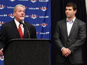Indianapolis Colts owner Jim Irsay (L) introduces the team's number one NFL draft pick, quarterback Andrew Luck during Luck's initial news conference in Indianapolis April 27, 2012. (REUTERS/Brent Smith)